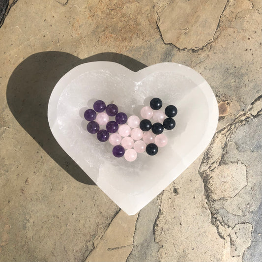 Rose Quartz, Amethyst, and Shungite gemstone beaded bracelet on elastic cord, designed for emotional healing, calm, and protective energy.