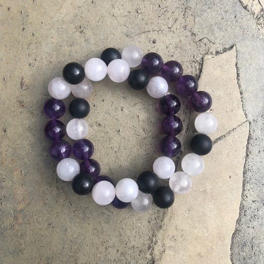 Rose Quartz, Amethyst, and Shungite gemstone beaded bracelet on elastic cord, designed for emotional healing, calm, and protective energy.