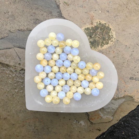 Citrine and blue lace agate beaded bracelet symbolising calmness, communication, and personal empowerment with soft ocean-inspired colours.