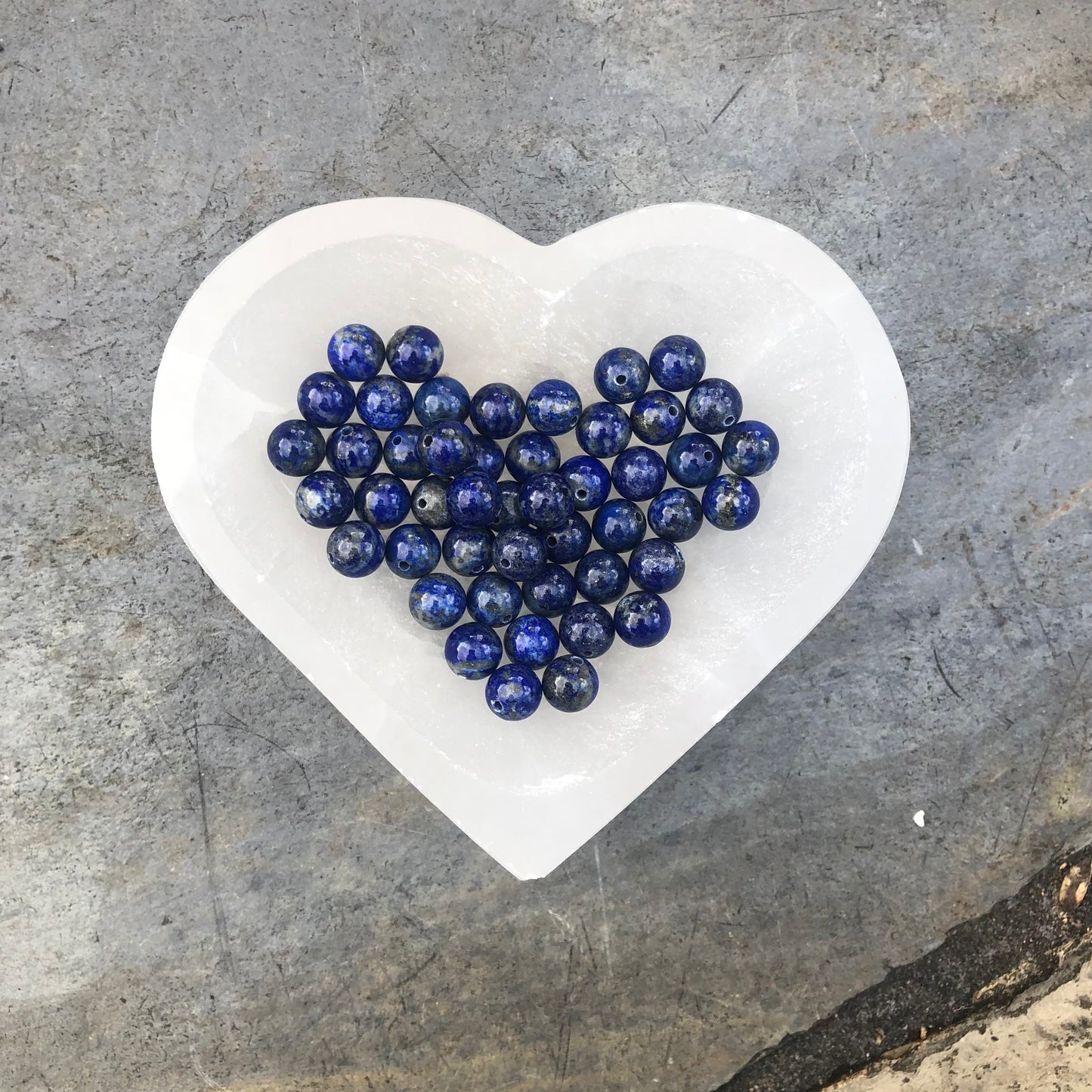Elegant lapis lazuli beaded bracelet with deep blue stones symbolising spiritual insight, calmness, and enhanced communication.