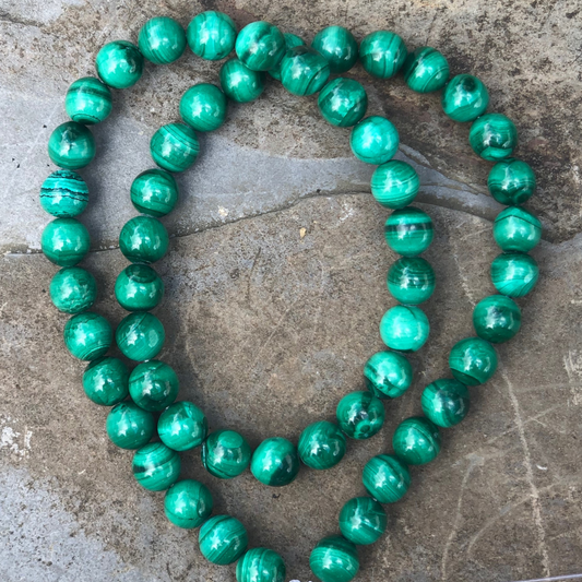 Mesmerising Malachite bracelet with vibrant green polished beads, designed for emotional healing, protection, and transformation. Handmade in New Zealand.