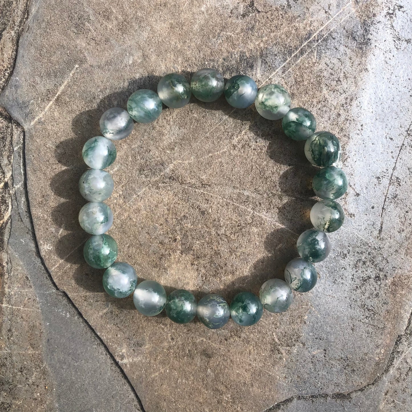 Handcrafted moss agate beaded bracelet with natural green tones, symbolising growth, grounding, and creative inspiration.