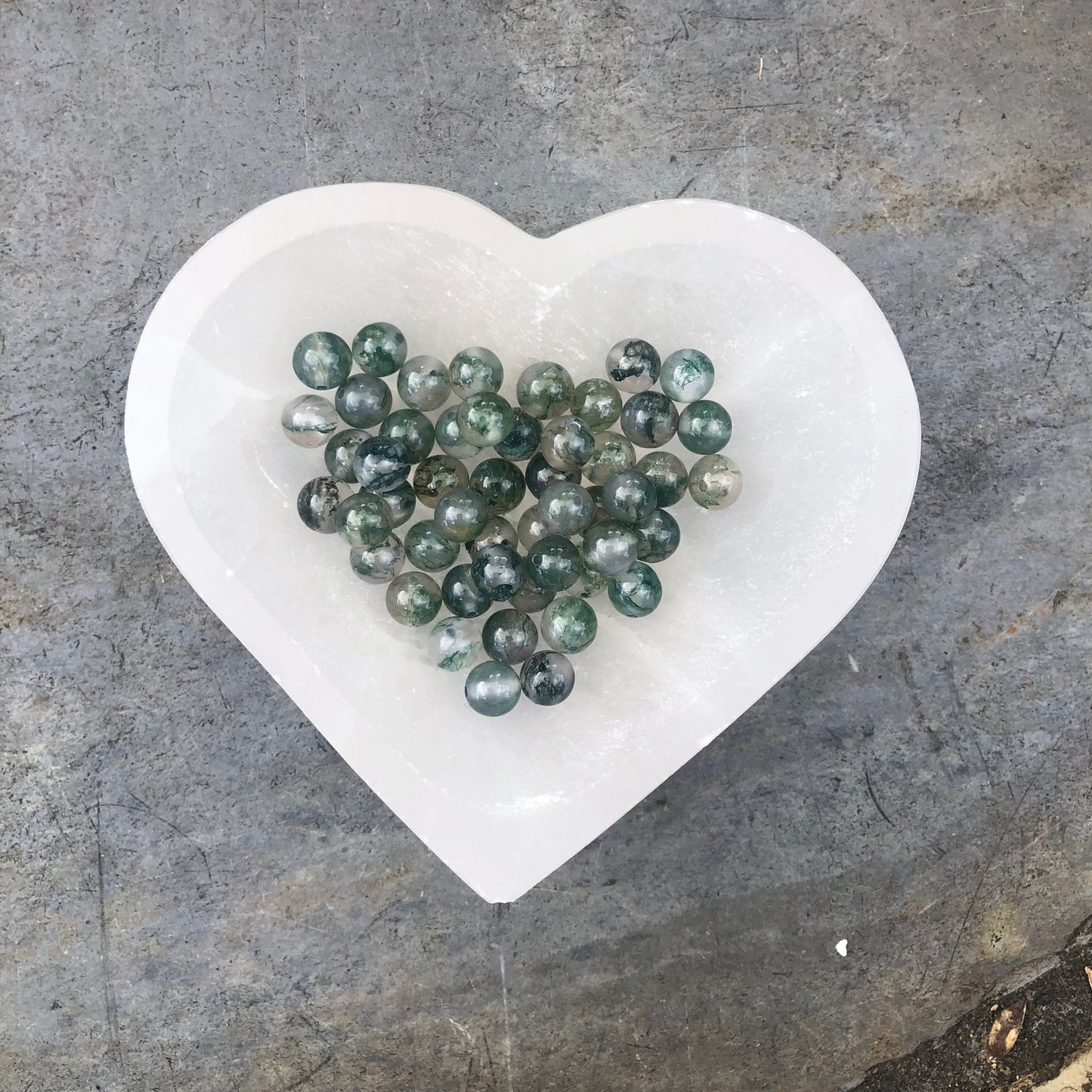 Handcrafted moss agate beaded bracelet with natural green tones, symbolising growth, grounding, and creative inspiration.