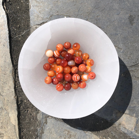Creative Carnelian bracelet with rich orange-red polished beads, designed to boost creativity, motivation, and emotional balance. Handmade in New Zealand.