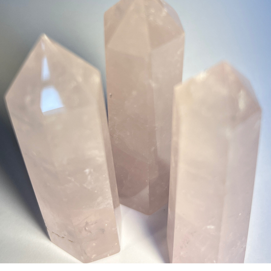 Polished rose quartz mini tower crystal, soft pink colour, associated with love, compassion, and emotional healing.