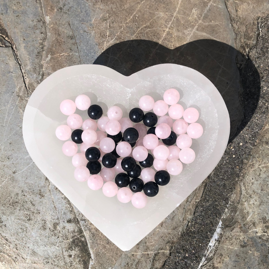 Grounded Emotions bracelet with soft pink Rose Quartz and deep black Shungite beads, designed for emotional balance, grounding, and protection. Handmade in NZ.
