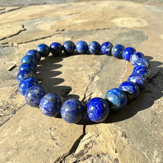 Elegant lapis lazuli beaded bracelet with deep blue stones symbolising spiritual insight, calmness, and enhanced communication.