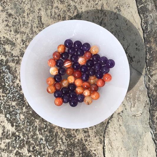 Onwards and Upwards bracelet featuring vibrant Carnelian and calming Amethyst beads for motivation, clarity, and emotional stability. Handmade in NZ.