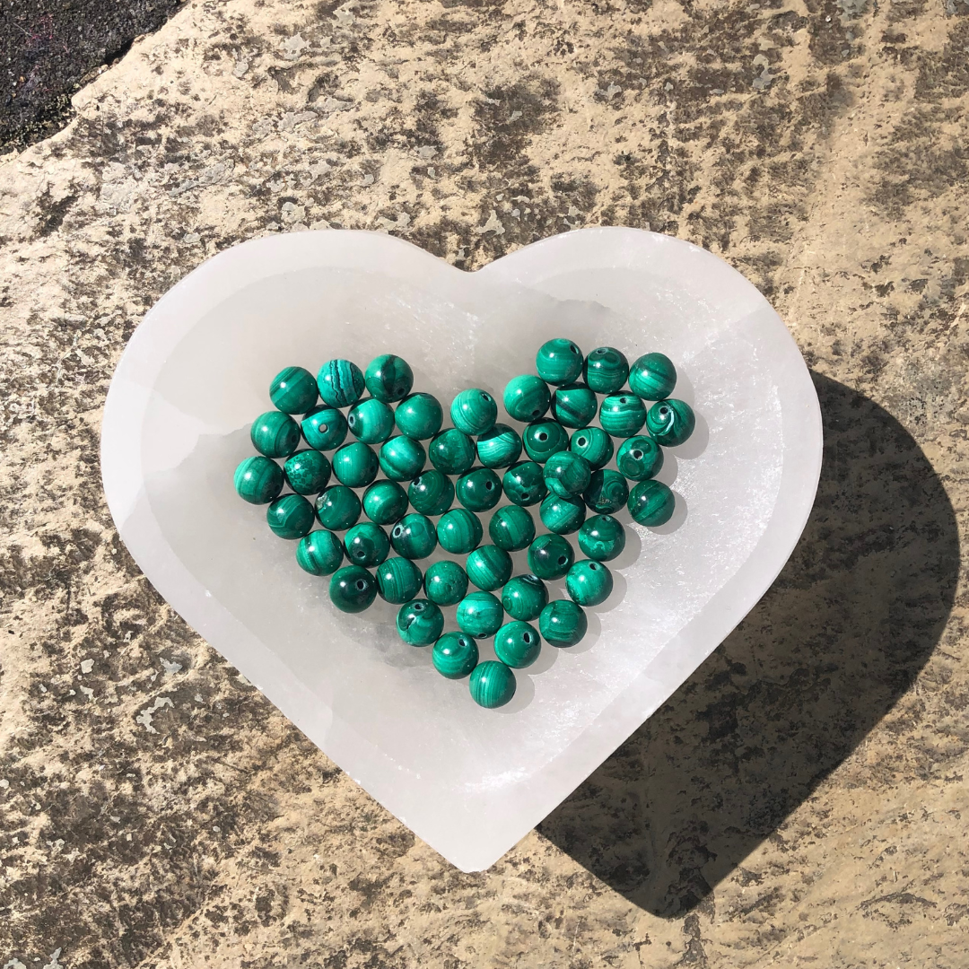 Mesmerising Malachite bracelet with vibrant green polished beads, designed for emotional healing, protection, and transformation. Handmade in New Zealand.