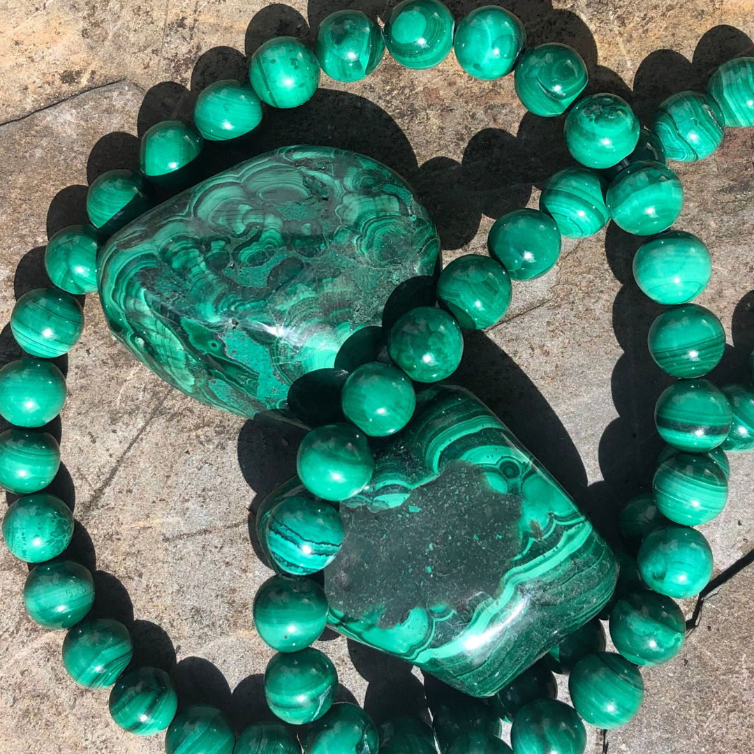 Mesmerising Malachite bracelet with vibrant green polished beads, designed for emotional healing, protection, and transformation. Handmade in New Zealand.