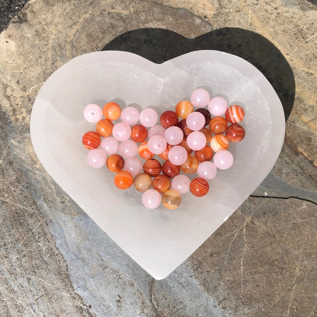 Move on with Courage and Joy bracelet featuring soft pink Rose Quartz and vibrant orange Carnelian beads for love, confidence, and emotional healing. Handmade in NZ.
